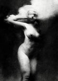Black and white fine art photograph of a nude female figure in motion, with her face obscured by a large cloud of smoke or mist against a dark background.  Unmoored series.