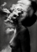 Black and white fine art photograph of a nude female figure with one arm braced overhead, her face obscured by a drifting cloud of smoke against a dark background. Unmoored series.