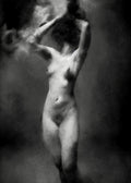 Black and white fine art photograph of a nude female figure in a smoking pose, with smoke blending into a dark, moody background. Unmoored series.