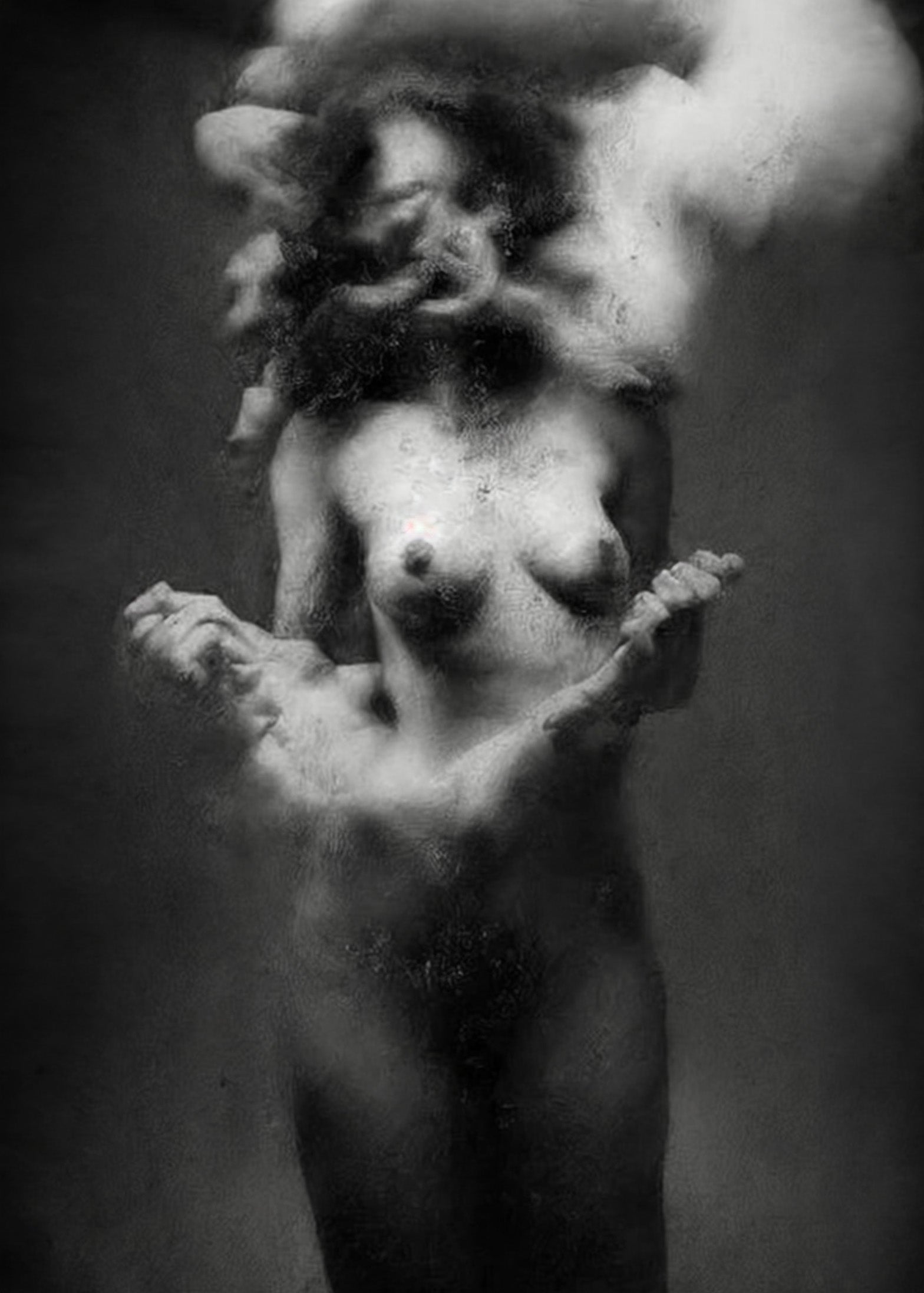 Black and white fine art photograph of a nude female figure with a classical sculpture-like finish, set against a dark studio background. Unmoored series.