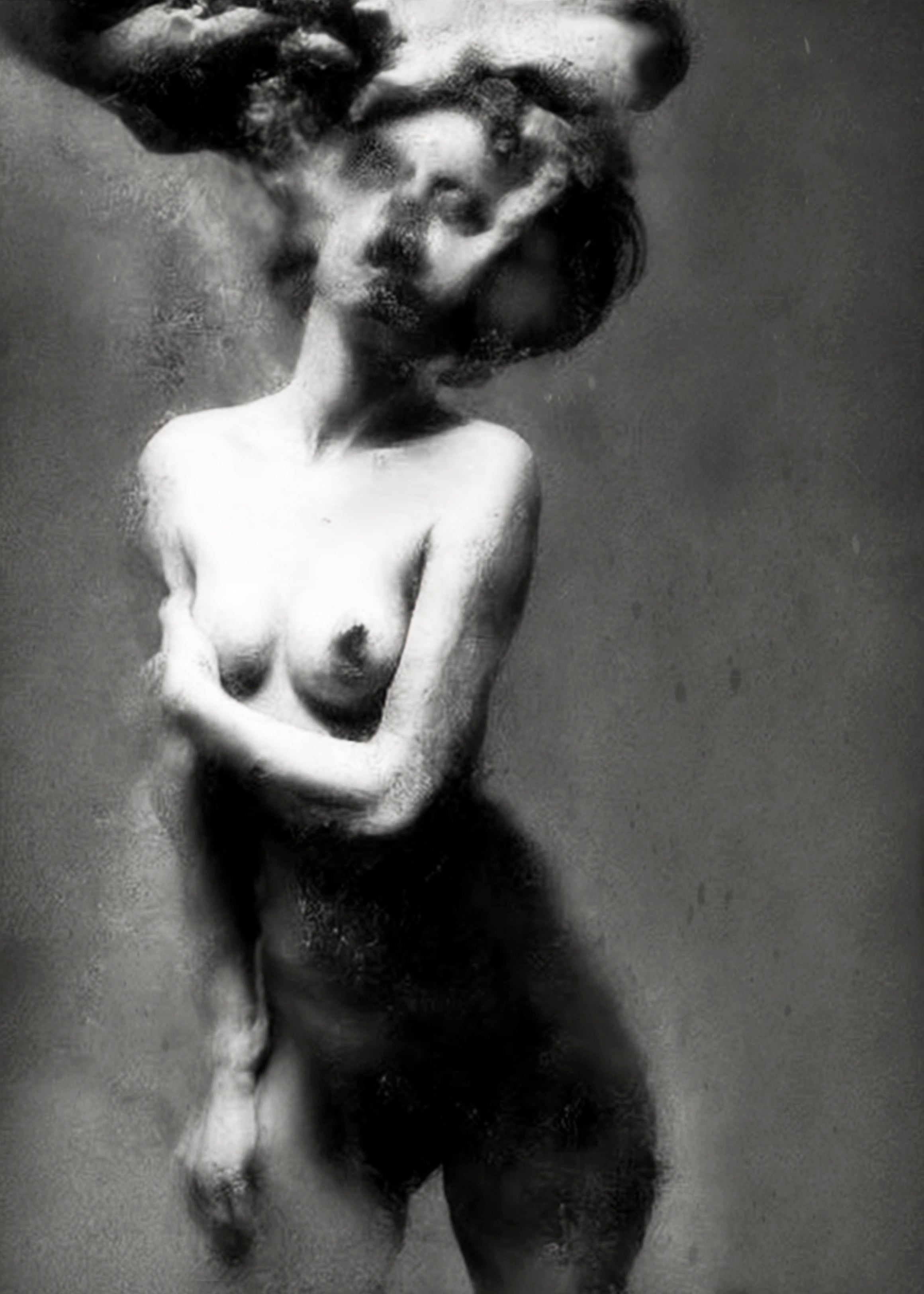 Black and white fine art photograph of a nude female figure with her arms crossed over her chest, her head enveloped in a swirling cloud of smoke, set against a textured gray background. Unmoored series.