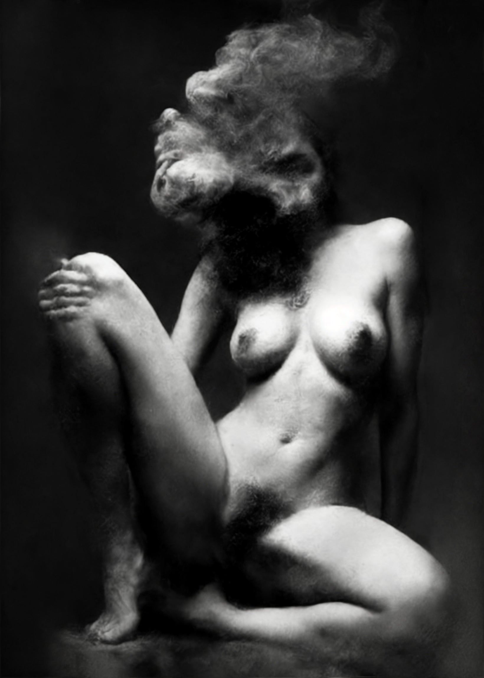 Black and white fine art photograph of a nude female figure in a seated pose, with smoke or vapor forming a distorted head against a dark studio background. Unmoored series.